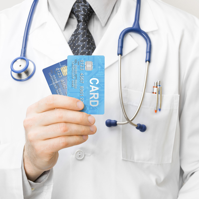 DOCTOR HOLDING CREDIT CARDS