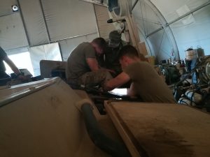 Soldiers working on Howitzer