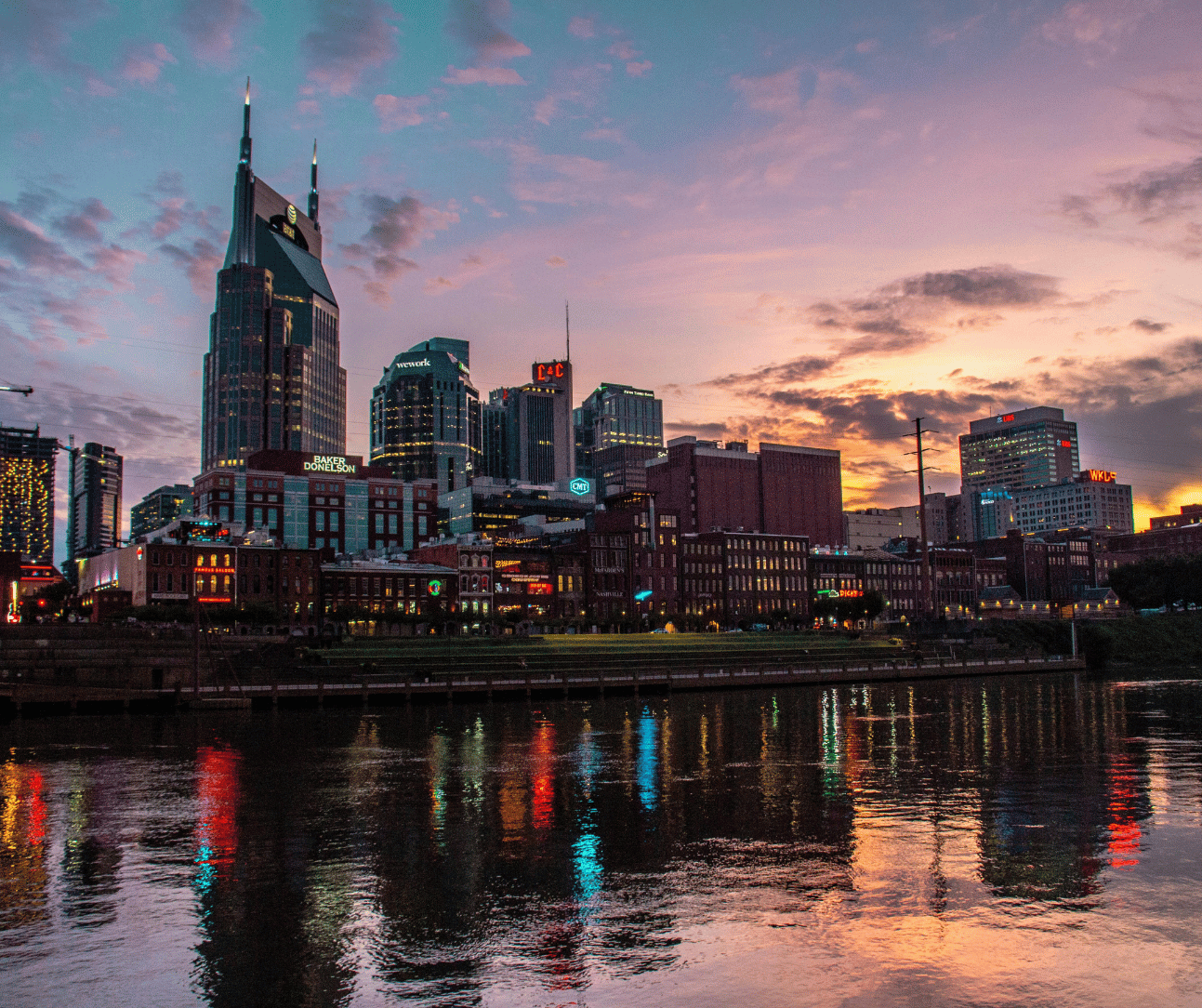 Panoramic view of the Nashville skyline at dusk, showcasing prominent buildings and the vibrant cityscape. The image represents the dynamic and bustling environment of Nashville, Tennessee, home to the Cole Law Group.